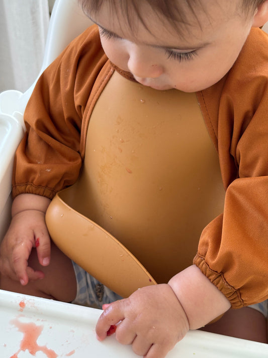 Smock Bib vs Silicone Bib: Why You Might Not Have to Choose